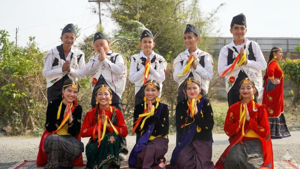 Students in traditional attire during a cultural performance