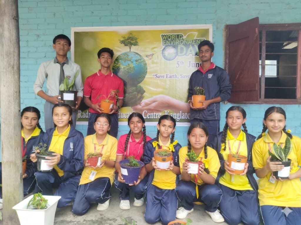 Students with plants during a World Environment Day activity
